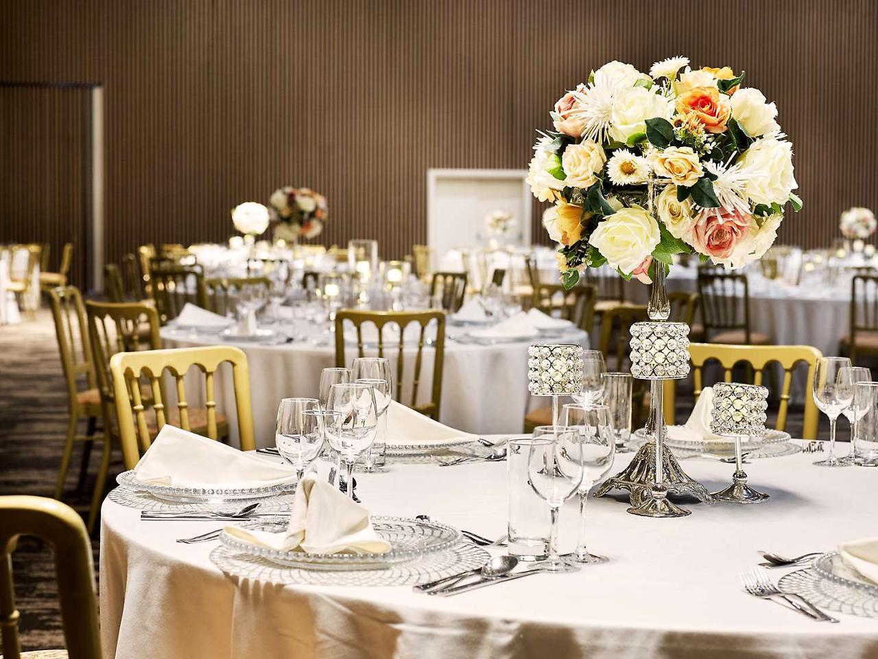 Radisson Blu Hotel & Convention Centre Kigali Exterior photo A table set for a formal dinner