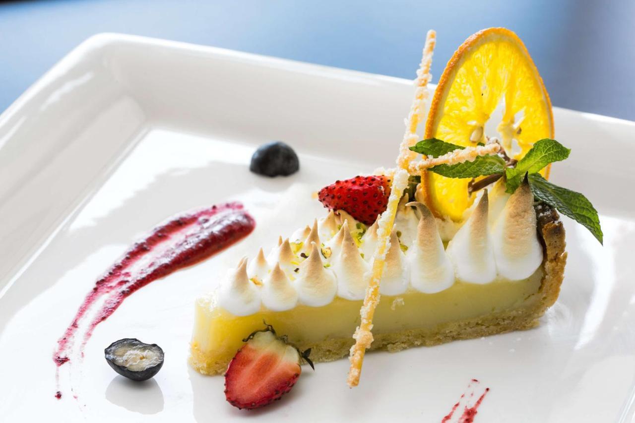 Radisson Blu Hotel & Convention Centre Kigali Exterior photo A lemon meringue tart